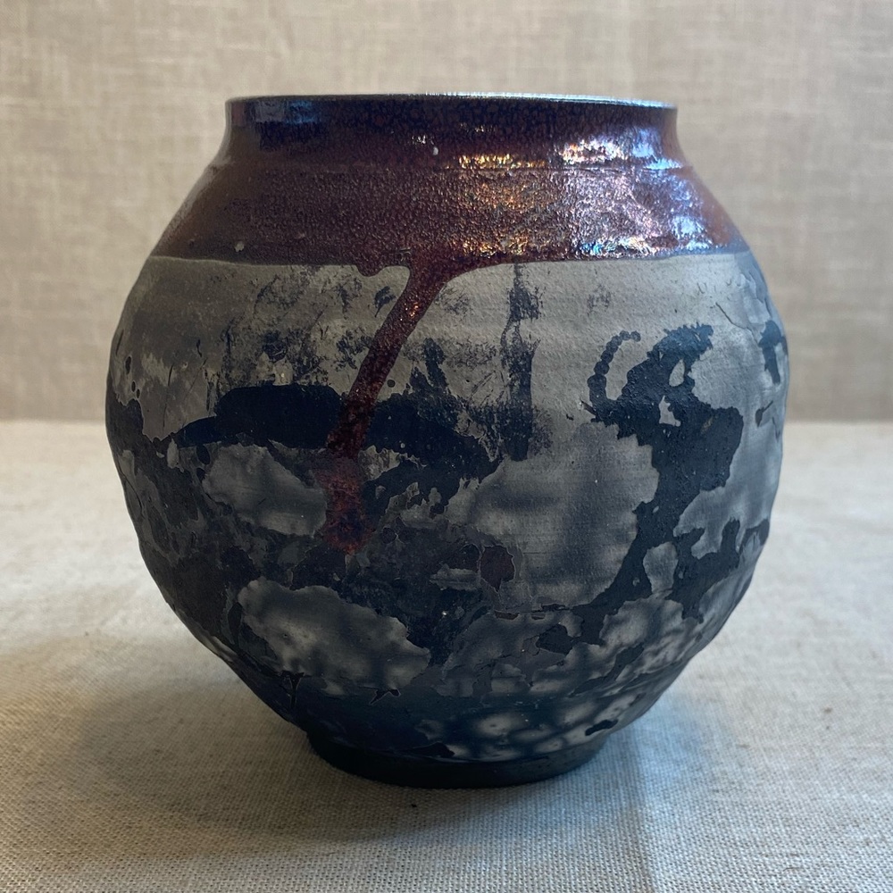 Vintage signed studio art pottery. There is a crack on bottom of vase.